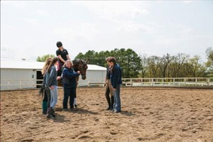 William Woods Professor teaches equestrian students about dressage.